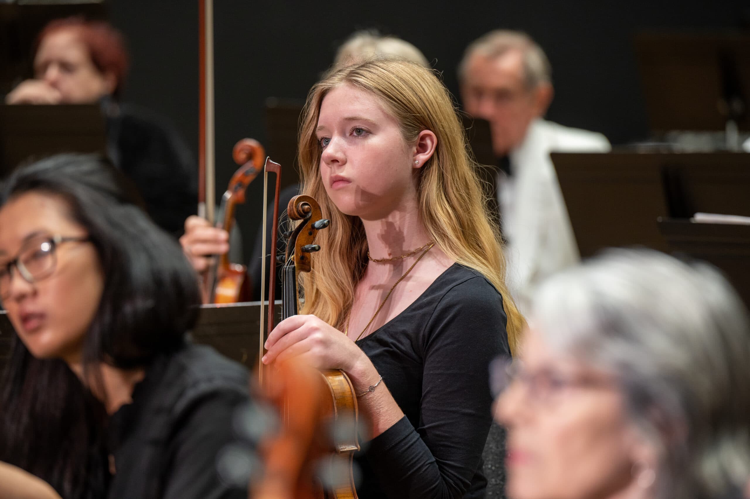 Student performers rehearsing with The Pops Orchestra
